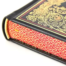 The leather-bound book "The Holy Gospel"
